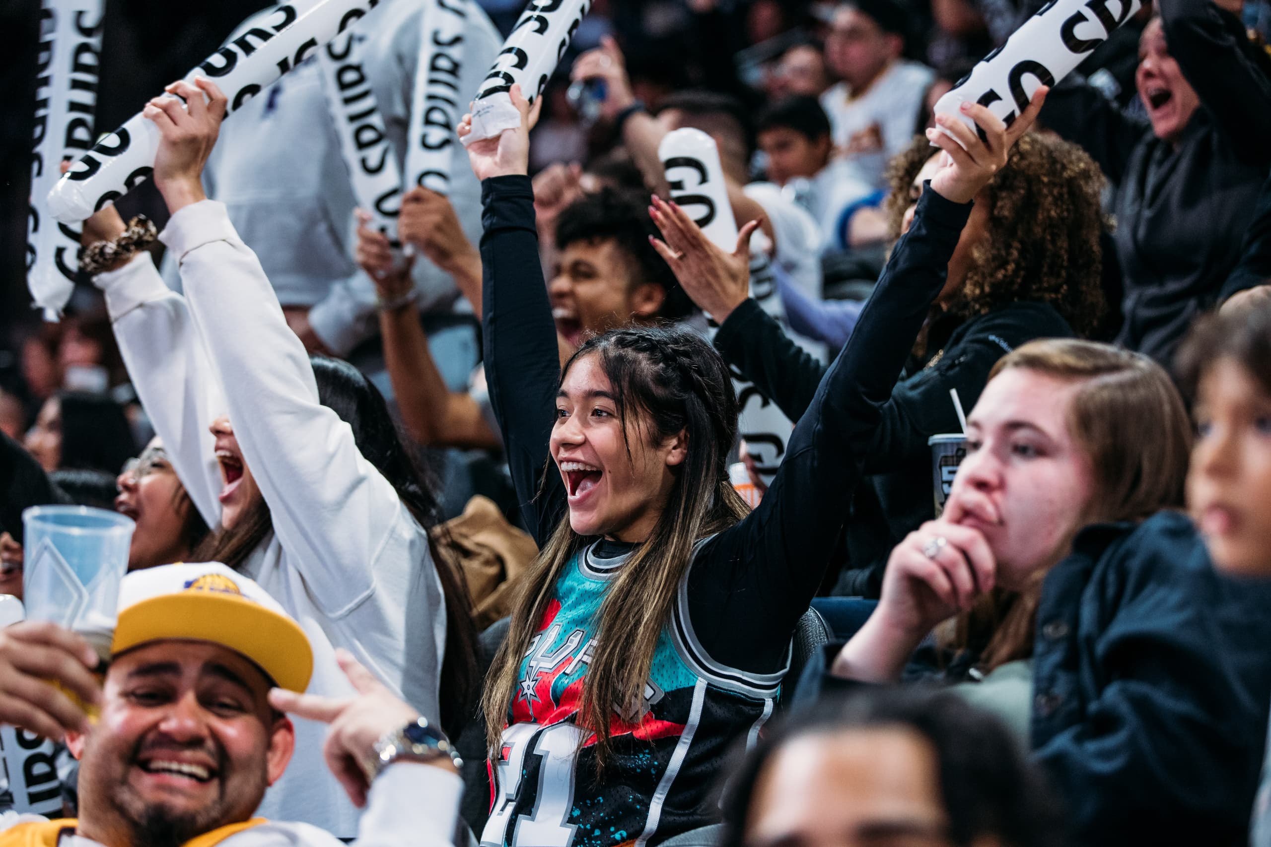 San Antonio fans on their feet cheering in the stands