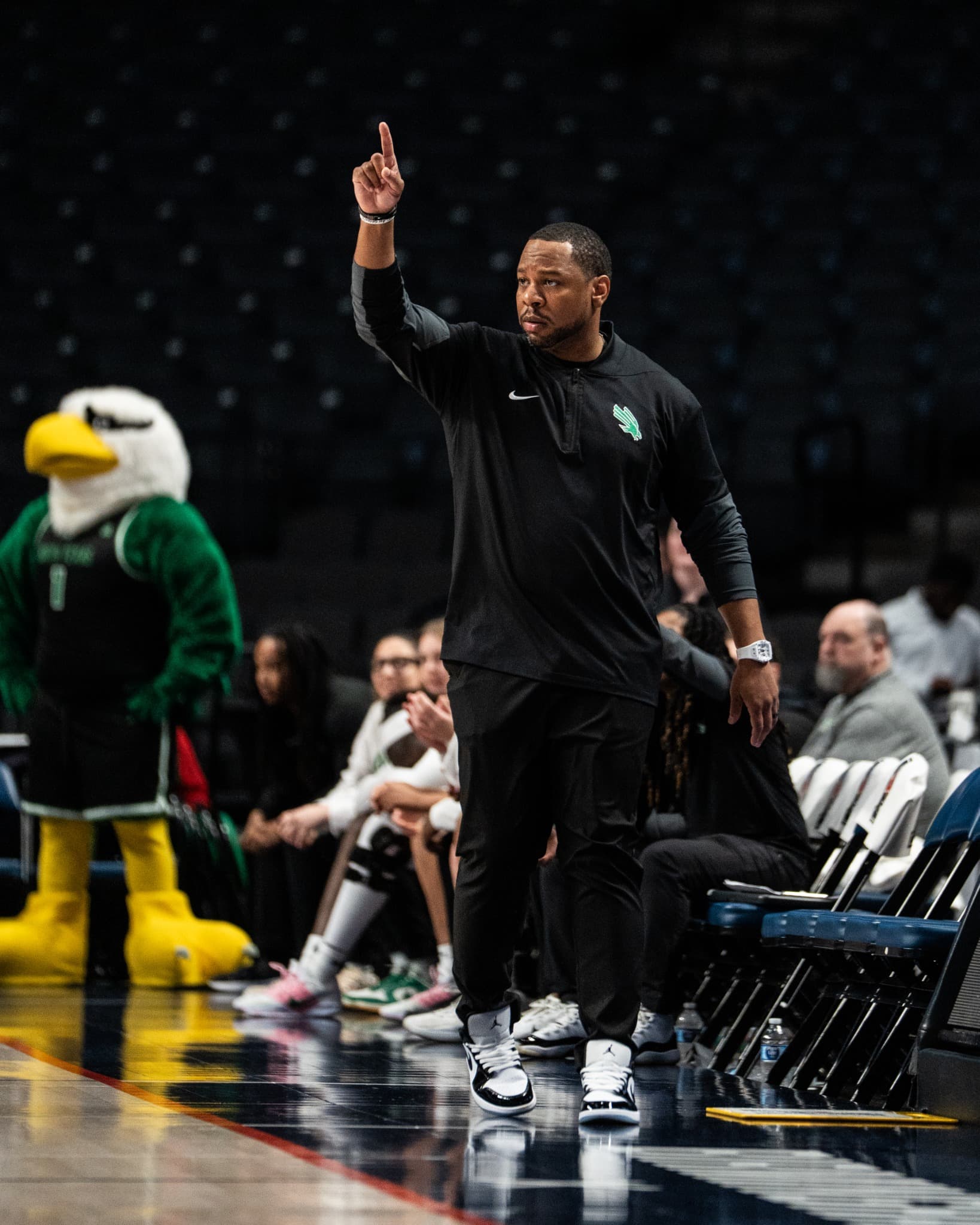 A coach directing play from the sideline