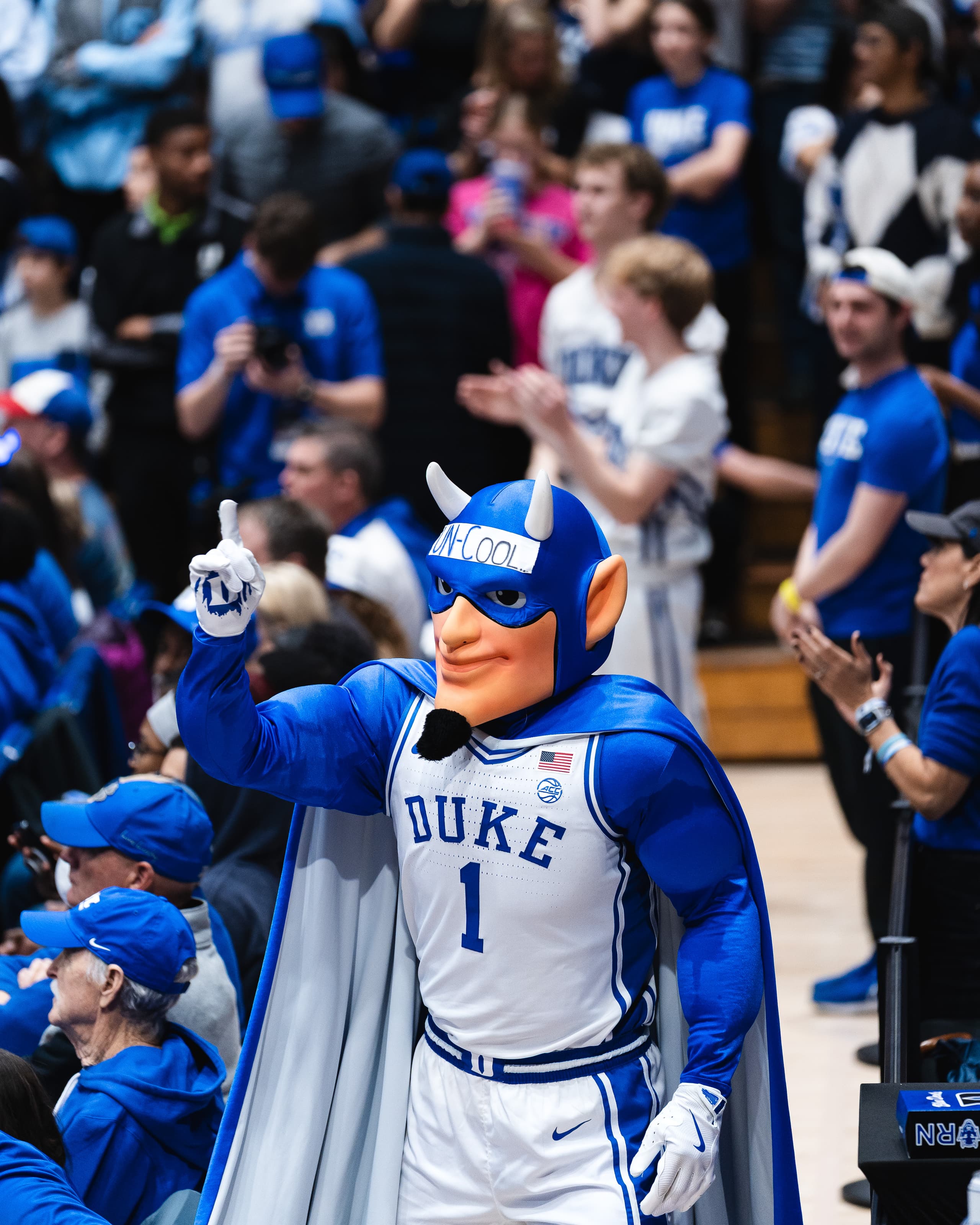 The Duke Blue Devil mascot rallying the crowd courtside