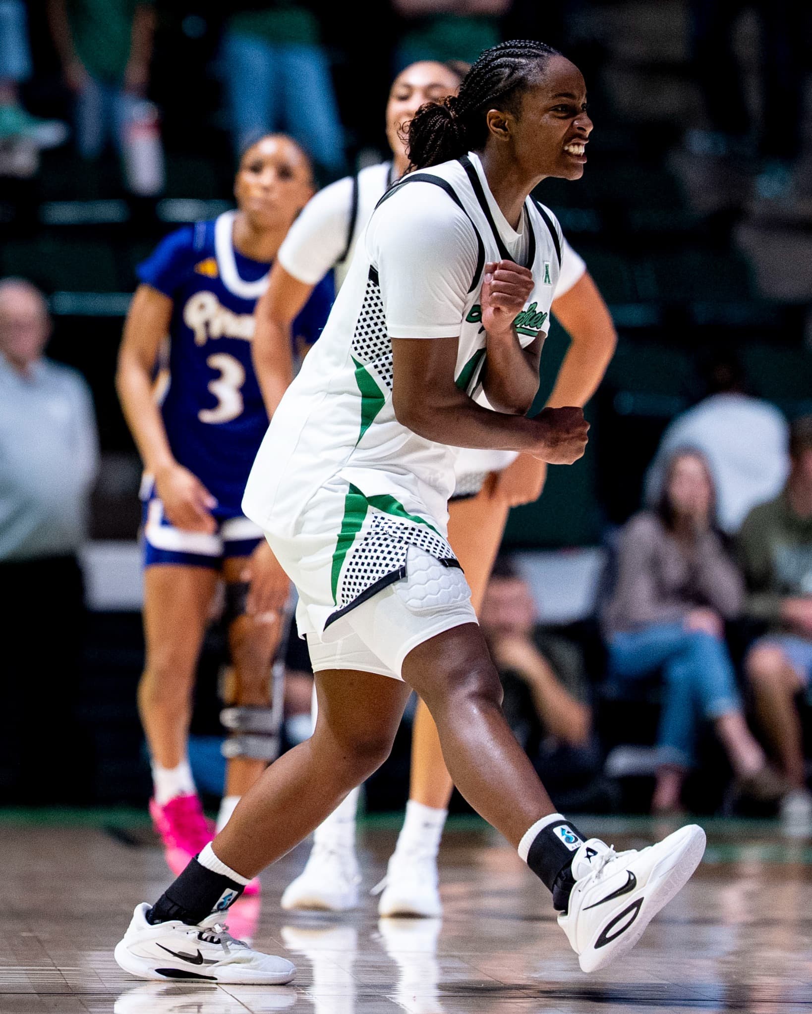 A North Texas player celebrating with a clenched fist after a play