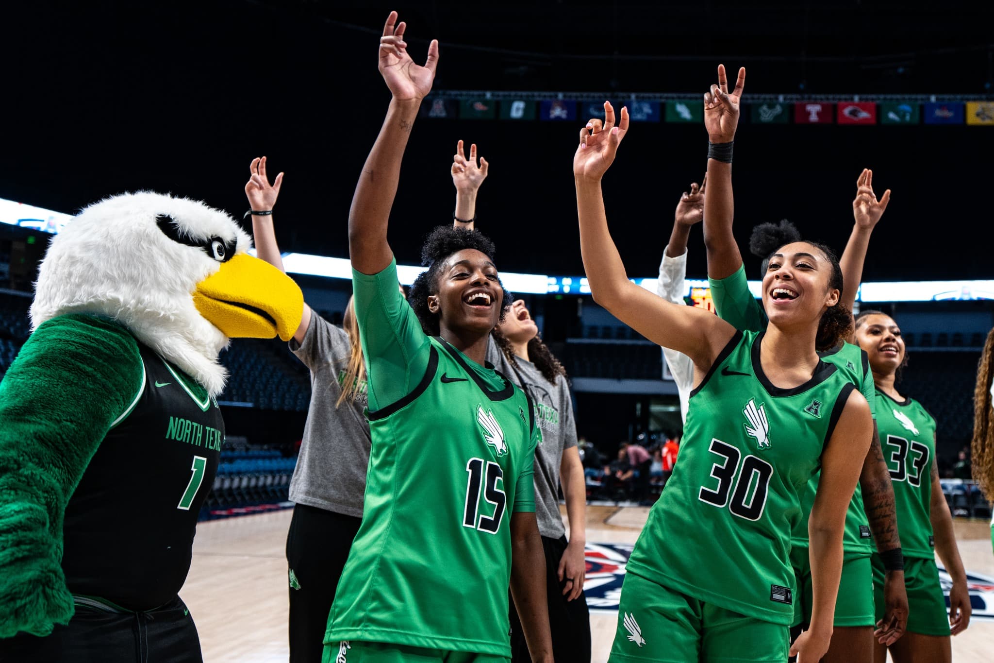 North Texas players celebrating with the eagle mascot